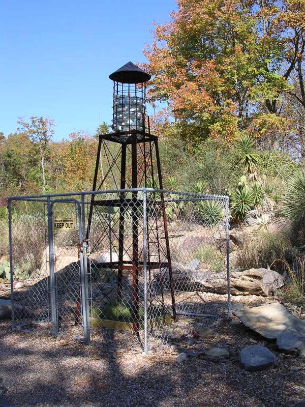 "Private Property" _In collaboration with Jan Chenoweth. 2002  Steel, Plastic water bottles, grass , wood.   In the collection of the North    Carolina Zoologiical Park.