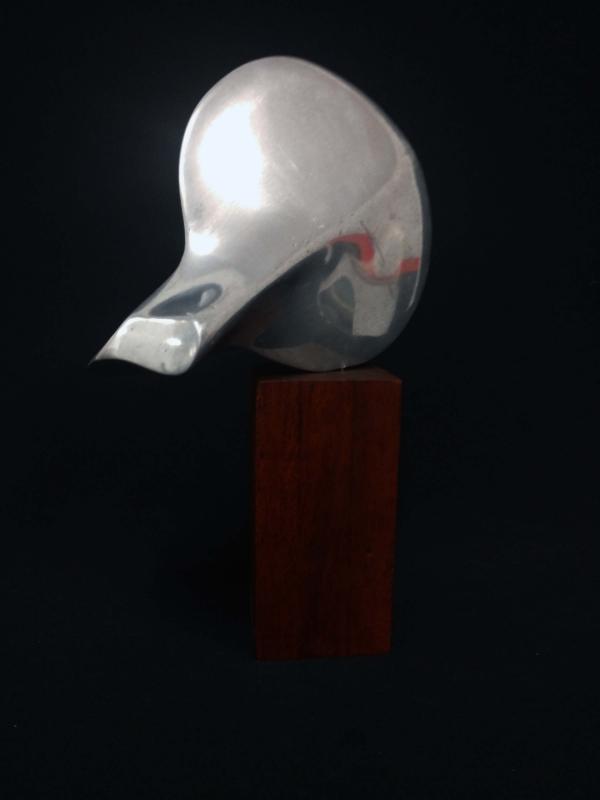 Untitled - Cast Aluminum on wooden base.. 9" x 6.5" x 3.5' 1974 