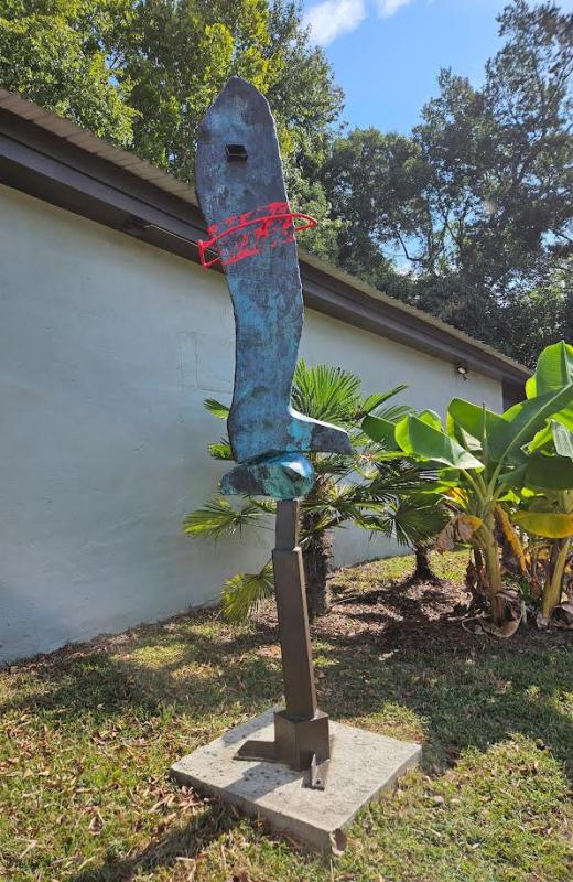 Redline Buoy 2025 -  102" x 22" x 16" .Welded and rusted steel, Galvanized lath, Portland concrete products, paint, acrylic paint, patina on bronze paint, Penetrol; on exposed steel, clear sealer on concrete forms. ( 2018-2025) .A4P 